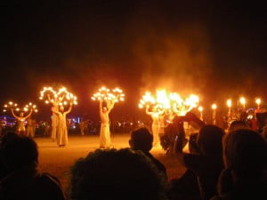 Fire dancers perform before the burn